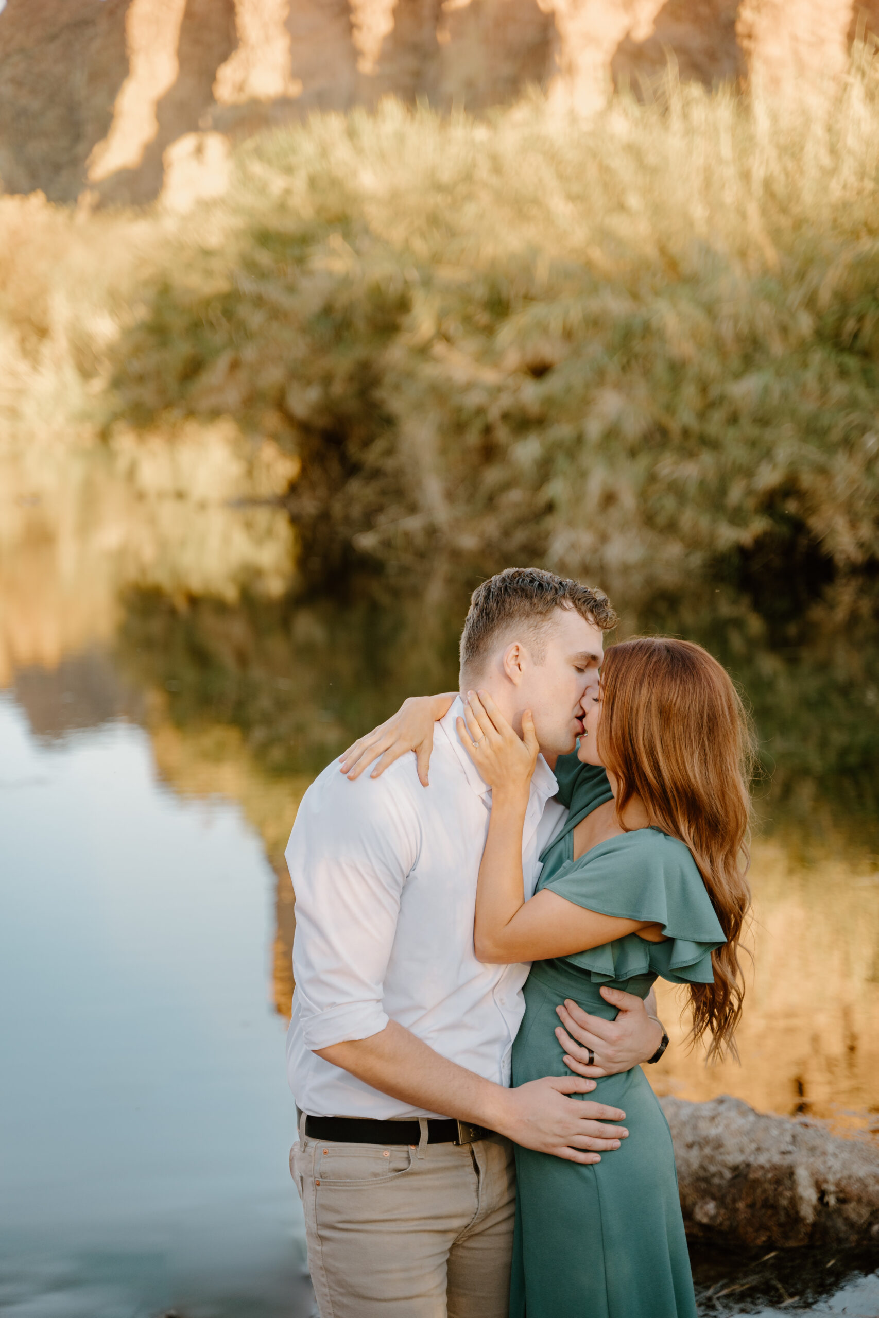 Couple kissing as they embrace one another at Lower Salt River for their Arizona engagement session