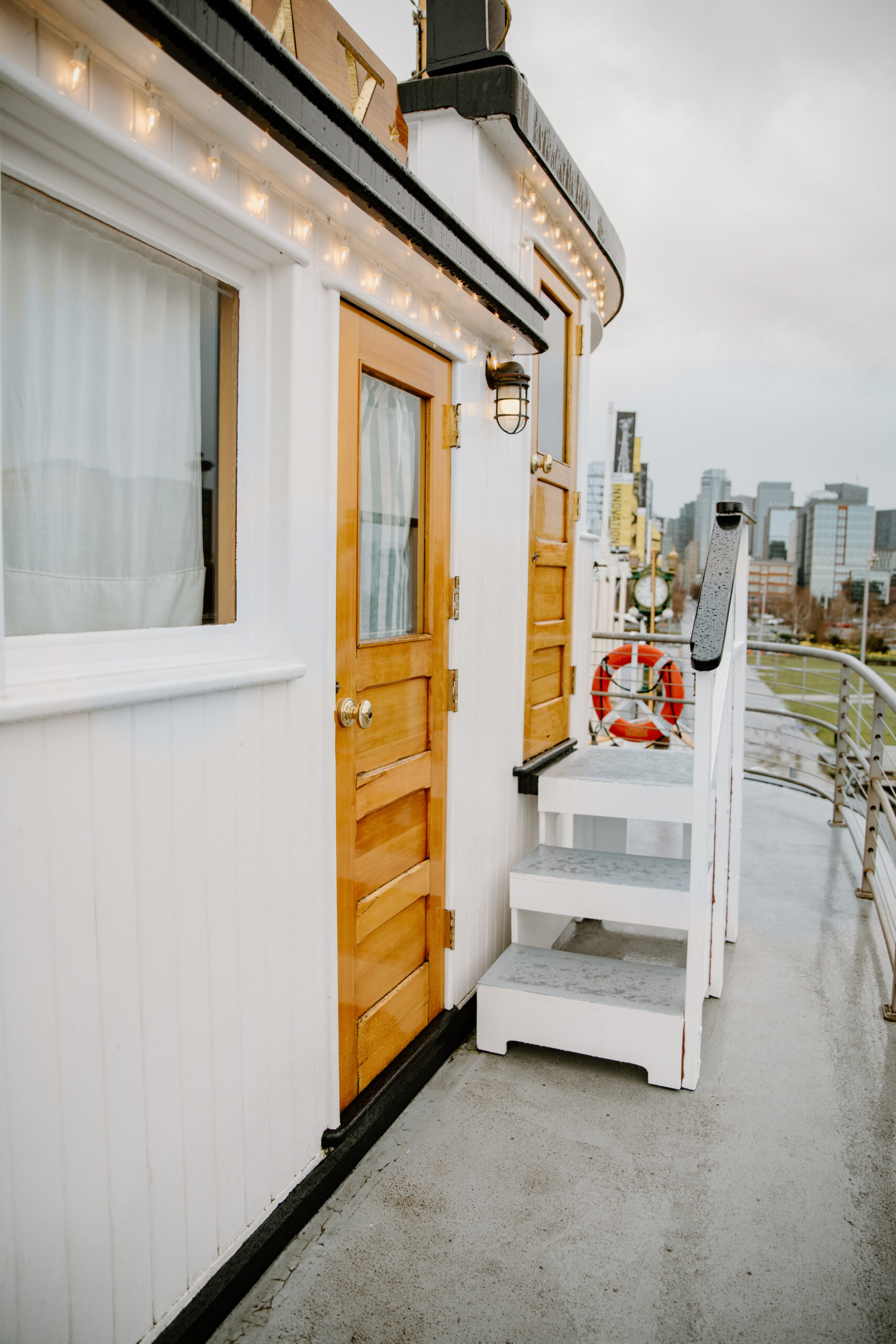 Charming wooden doors and white railings of a classic boat, styled for a Virginia wedding venue experience.