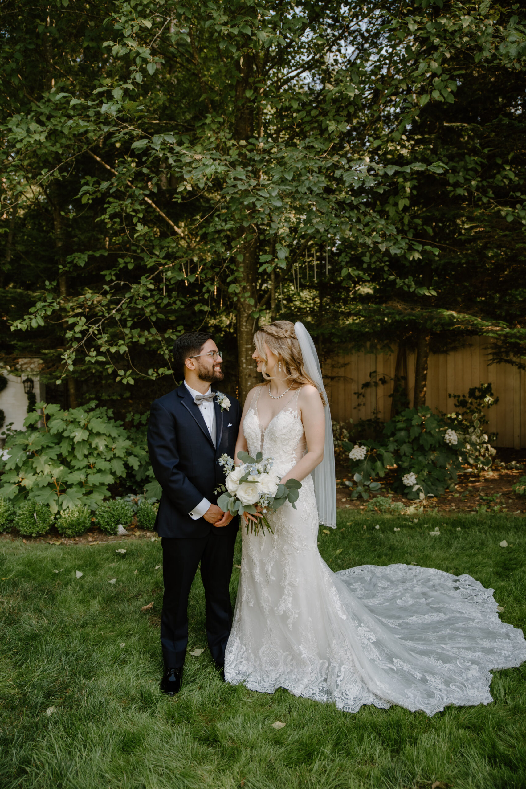 The couple share a tender moment with foreheads pressed together under the golden glow of sunset