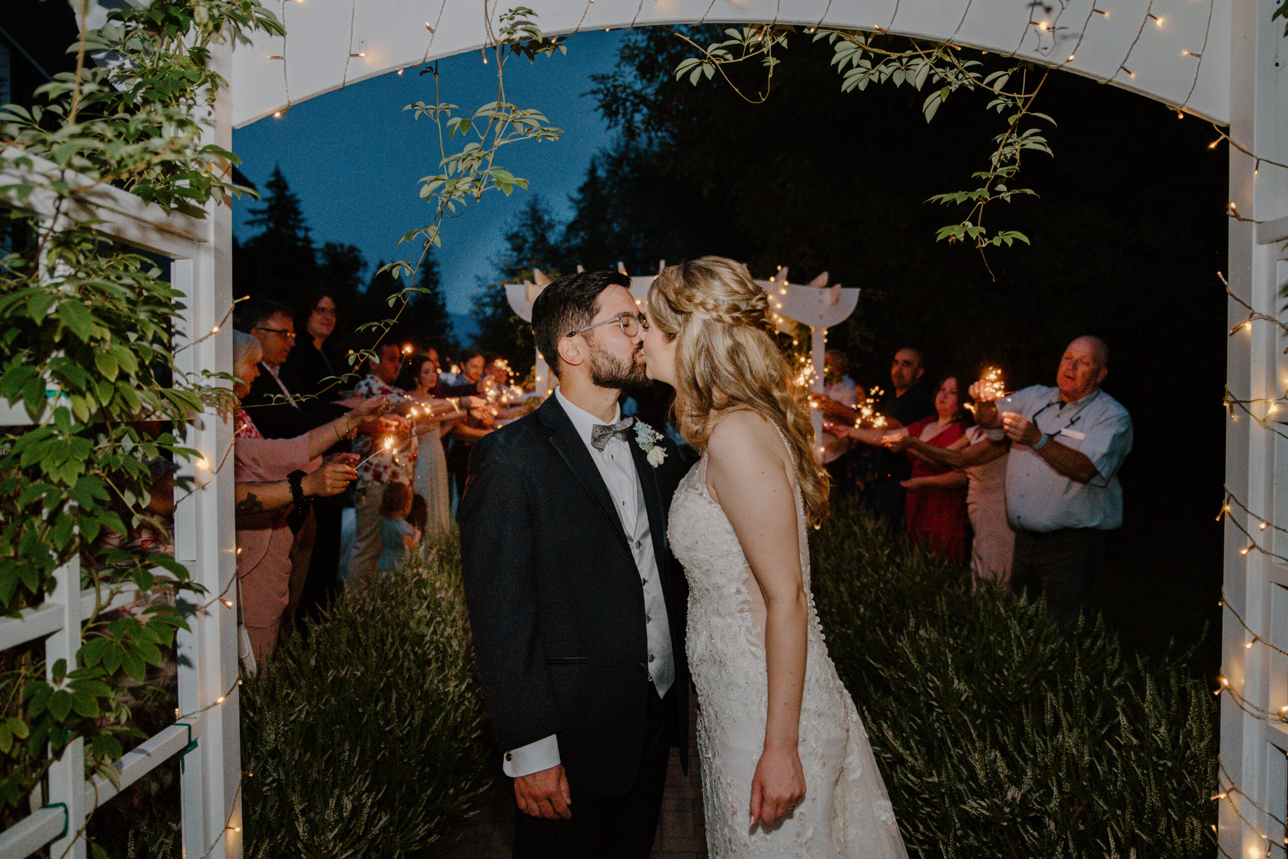 Bride and groom kissing after their wedding exit