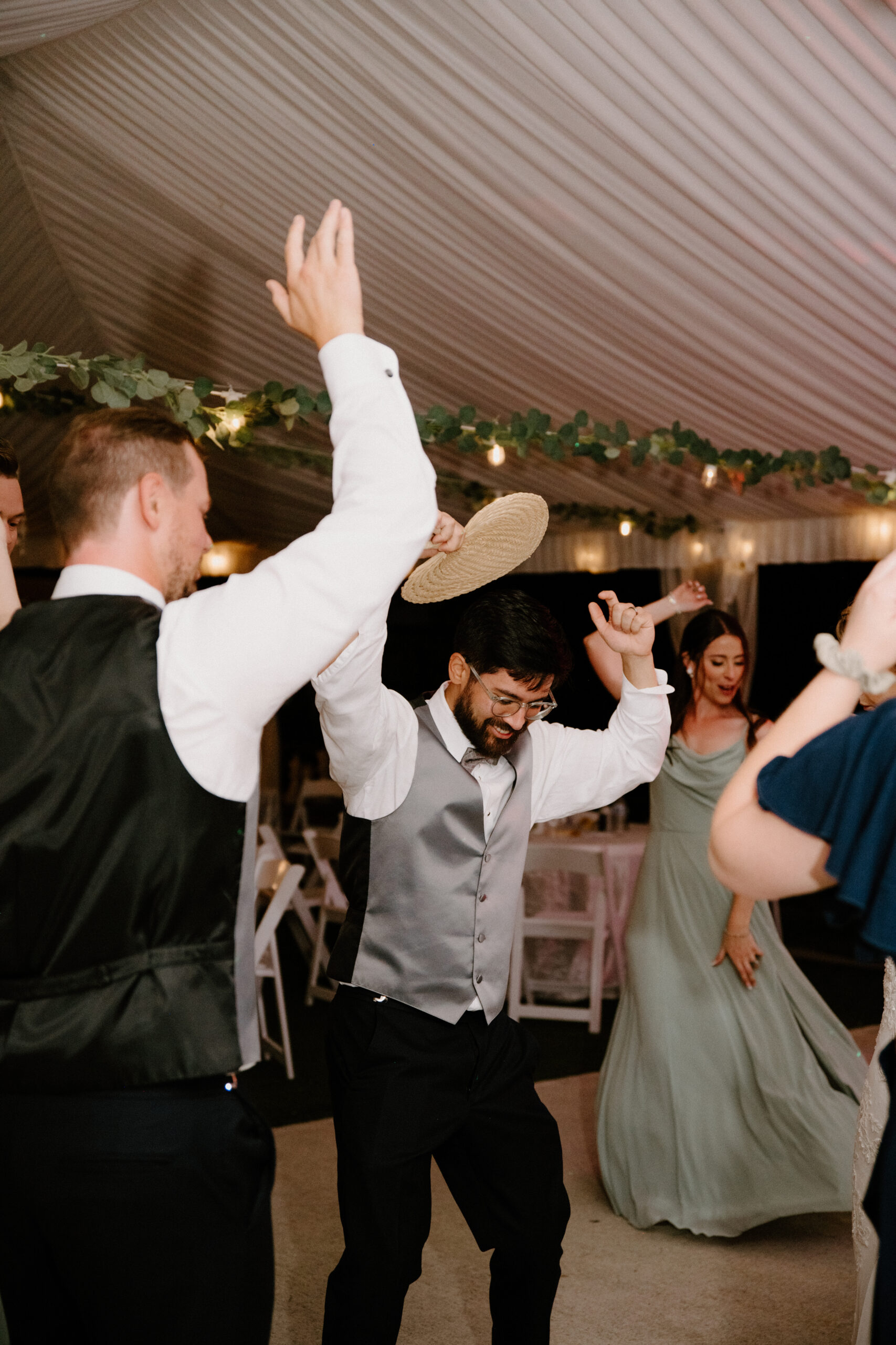 Groom dancing with guests at his wedding reception