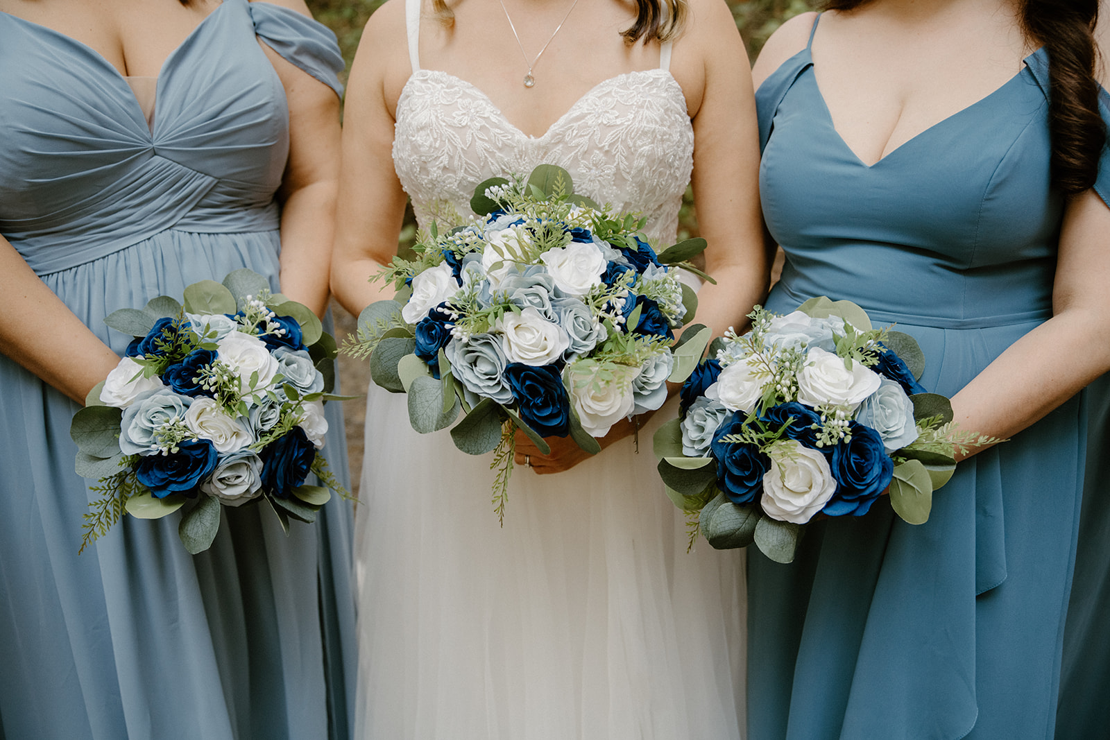 Bride and bridesmaids blue and white bouquets