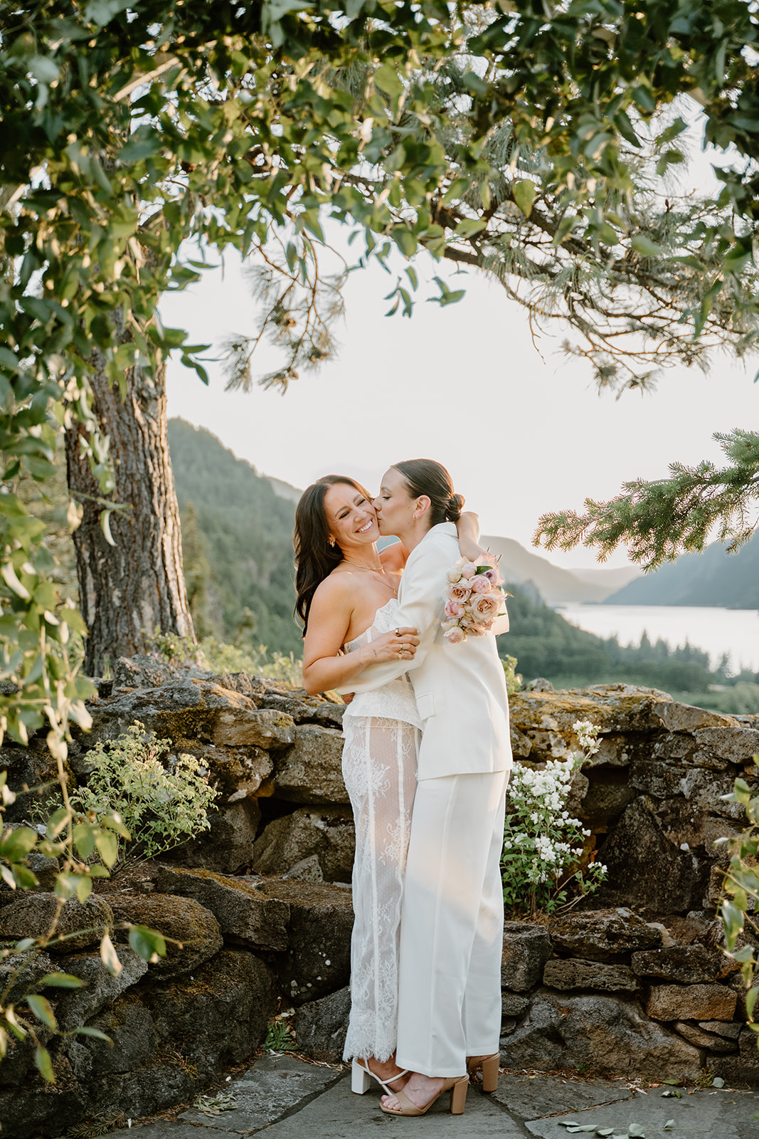A couple standing at their ceremony spot overlooking the gorge for some elegant wedding portraits for their Griffin House Wedding